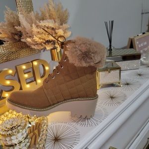 Nicole Miller Faux fur cuff wedge boots.